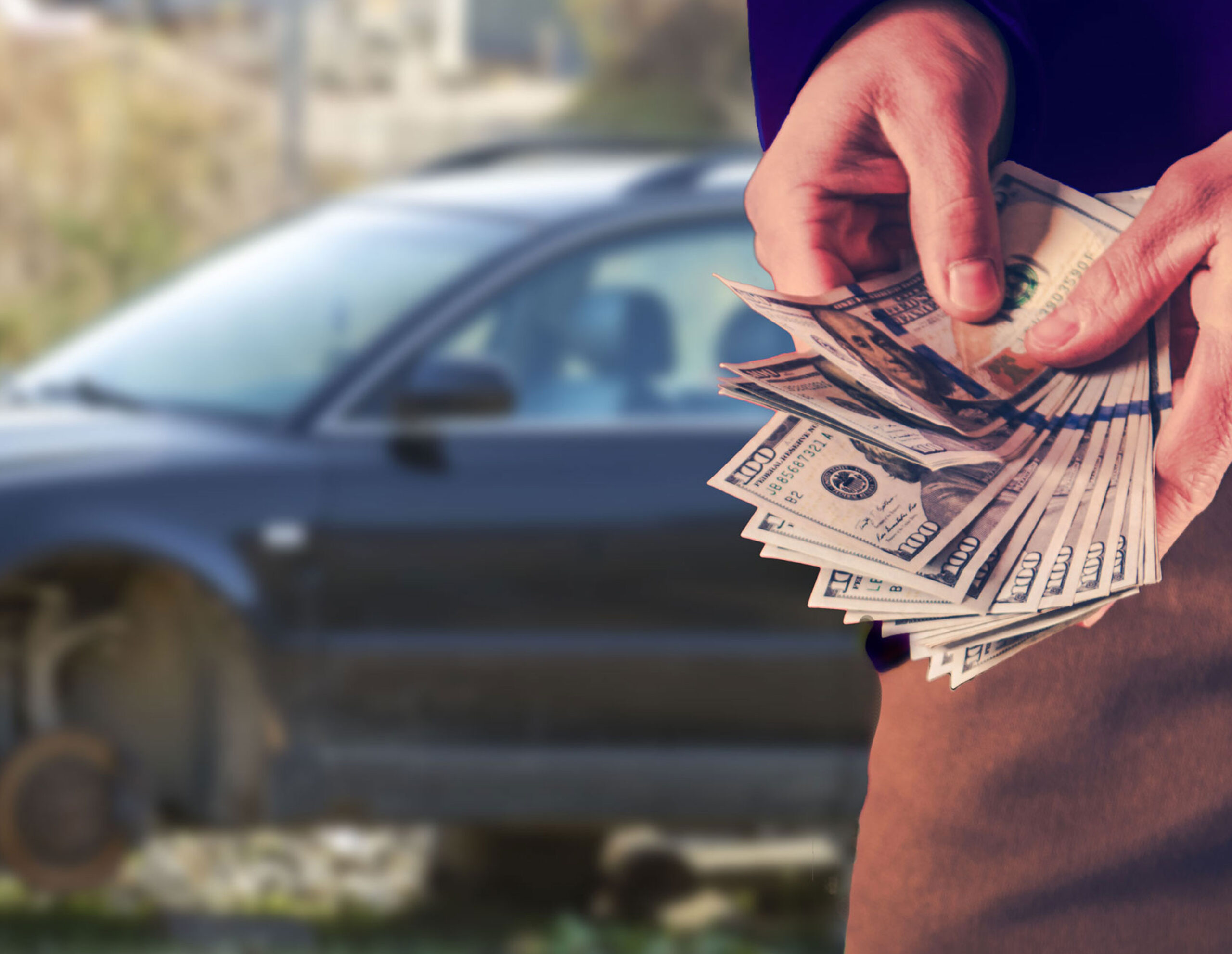 Close up of a person counting cash.